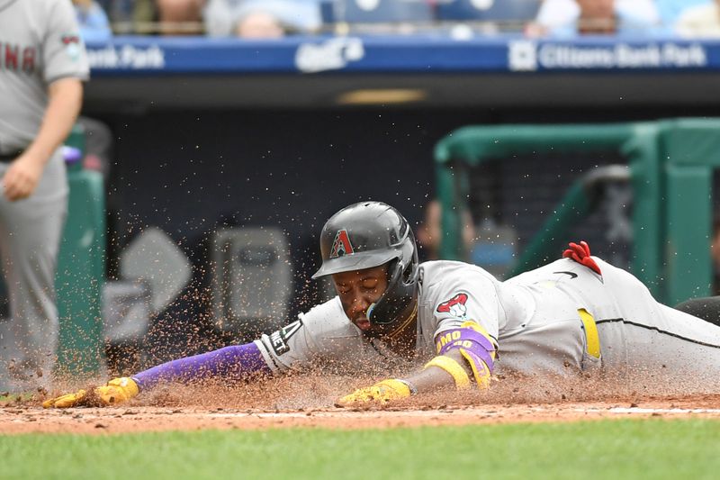 May 4, 2025; Philadelphia, Pennsylvania, USA; Arizona Diamondbacks shortstop Geraldo Perdomo (2) slides safely into home during the third inning against the Philadelphia Phillies at Citizens Bank Park. Mandatory Credit: Eric Hartline-Imagn Images