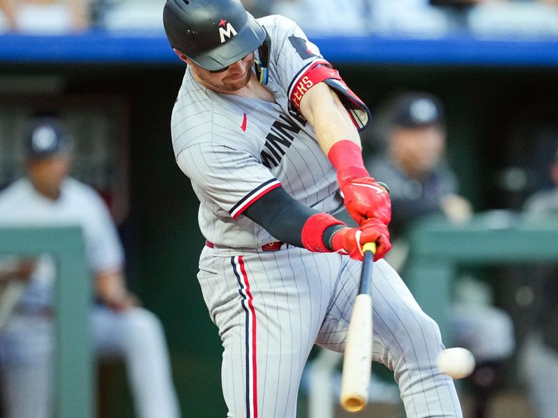 Jul 28, 2023; Kansas City, Missouri, USA; Minnesota Twins catcher Ryan Jeffers (27) hits an RBI single during the fourth inning against the Kansas City Royals at Kauffman Stadium. Mandatory Credit: Jay Biggerstaff-USA TODAY Sports