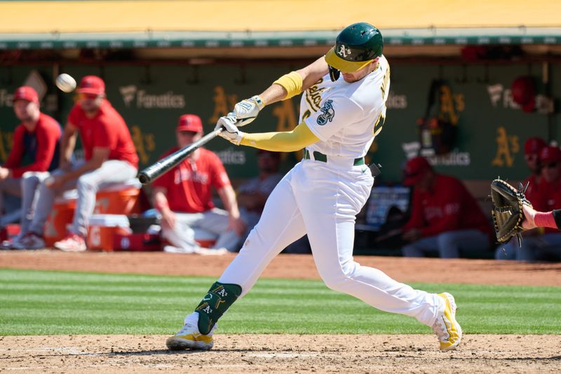 Sep 3, 2023; Oakland, California, USA; Oakland Athletics infielder Ryan Noda (49) hits a two run home run against the Los Angeles Angels during the sixth inning at Oakland-Alameda County Coliseum. Mandatory Credit: Robert Edwards-USA TODAY Sports