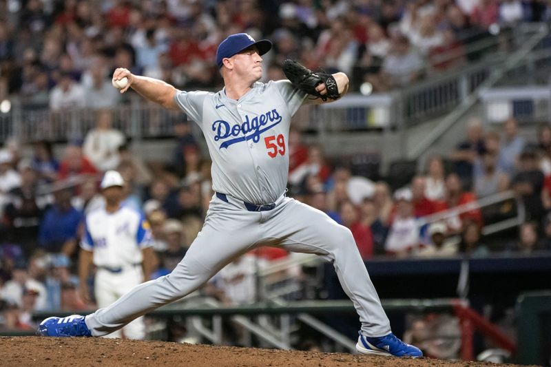 Sep 14, 2024; Cumberland, Georgia, USA; Los Angeles Dodgers pitcher Evan Phillips (59) pitches against Atlanta Braves during the sixth inning at Truist Park. Mandatory Credit: Jordan Godfree-Imagn Images