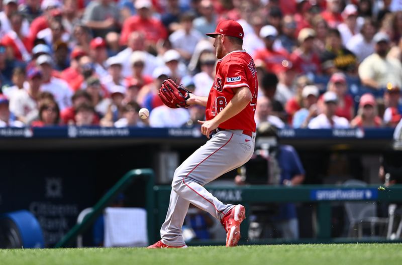 Aug 30, 2023; Philadelphia, Pennsylvania, USA; Los Angeles Angels starting pitcher Reid Detmers (48) misses a fly ball against the Philadelphia Phillies in the fourth inning at Citizens Bank Park. Mandatory Credit: Kyle Ross-USA TODAY Sports