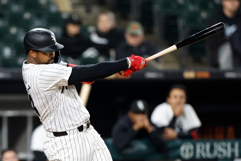 Apr 26, 2024; Chicago, Illinois, USA; Chicago White Sox designated hitter Eloy Jimenez (74) hits a two-run home run against the Tampa Bay Rays during the seventh inning at Guaranteed Rate Field. Mandatory Credit: Kamil Krzaczynski-USA TODAY Sports