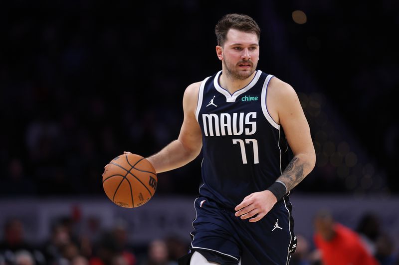 WASHINGTON, DC - NOVEMBER 15: Luka Doncic #77 of the Dallas Mavericks dribbles the ball against the Washington Wizards during the first half at Capital One Arena on November 15, 2023 in Washington, DC. NOTE TO USER: User expressly acknowledges and agrees that, by downloading and or using this photograph, User is consenting to the terms and conditions of the Getty Images License Agreement. (Photo by Patrick Smith/Getty Images)