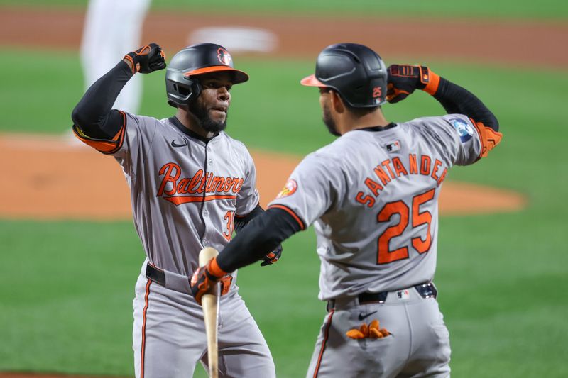 Sep 10, 2024; Boston, Massachusetts, USA; Baltimore Orioles center fielder Cedric Mullins (31) celebrates with Baltimore Orioles right fielder Anthony Santander (25) after hitting a solo home run during the first inning against the Boston Red Sox at Fenway Park. Mandatory Credit: Paul Rutherford-Imagn Images