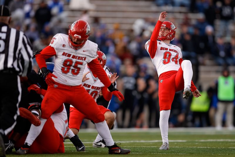 Nov 12, 2022; Colorado Springs, Colorado, USA; New Mexico Lobos place kicker Luke Drzewiecki (94) watches his field goal attempt as defensive end Jake Saltonstall (95) and punter Aaron Rodriguez (10) defend in the third quarter against the Air Force Falcons at Falcon Stadium. Mandatory Credit: Isaiah J. Downing-USA TODAY Sports