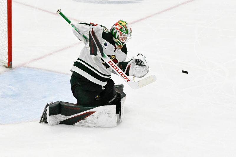 Apr 7, 2024; Chicago, Illinois, USA;  Minnesota Wild goaltender Jesper Wallstedt (30) defends against a shot during the third period against the Chicago Blackhawks  at United Center. Mandatory Credit: Matt Marton-USA TODAY Sports