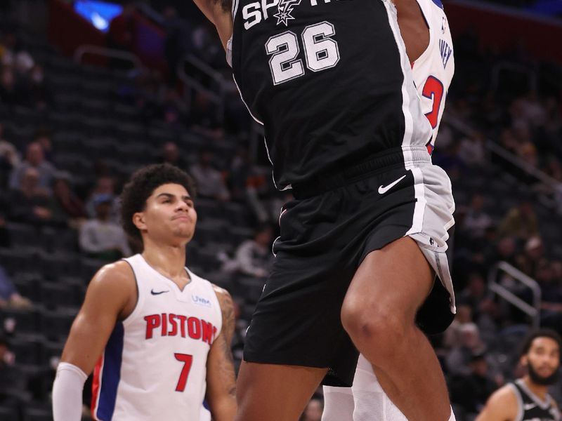 DETROIT, MICHIGAN - JANUARY 10: Dominick Barlow #26 of the San Antonio Spurs dunks in front of Jaden Ivey #23 of the Detroit Pistons during the second half at Little Caesars Arena on January 10, 2024 in Detroit, Michigan. San Antonio Spurs won the game 130-108. NOTE TO USER: User expressly acknowledges and agrees that, by downloading and or using this photograph, User is consenting to the terms and conditions of the Getty Images License  (Photo by Gregory Shamus/Getty Images)