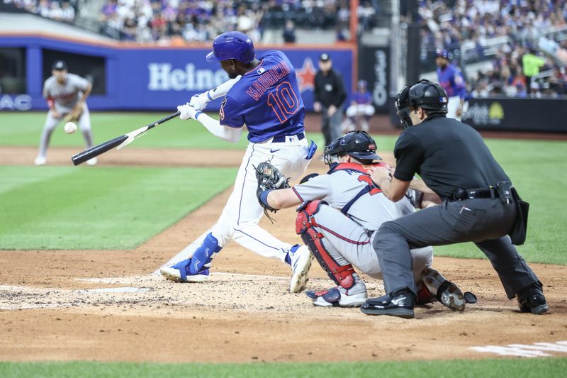 Jun 26, 2025; New York City, New York, USA;  New York Mets second baseman Ronny Mauricio (10) hits a single in the third inning against the Atlanta Braves at Citi Field. Mandatory Credit: Wendell Cruz-Imagn Images