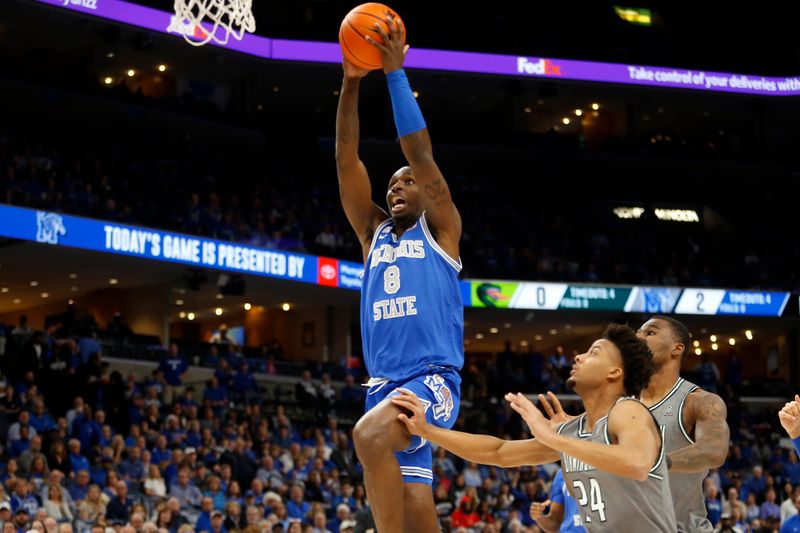 Mar 3, 2024; Memphis, Tennessee, USA; Memphis Tigers forward David Jones (8) drives to the basket during the first half against the UAB Blazers at FedExForum. Mandatory Credit: Petre Thomas-USA TODAY Sports