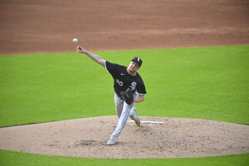 Jul 3, 2024; Cleveland, Ohio, USA; Chicago White Sox starting pitcher Erick Fedde (20) delivers a pitch in the second inning against the Cleveland Guardians at Progressive Field. Mandatory Credit: David Richard-USA TODAY Sports