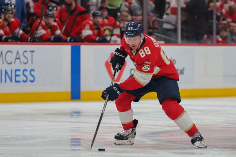 Apr 10, 2025; Sunrise, Florida, USA; Florida Panthers defenseman Nate Schmidt (88) moves the puck against the Detroit Red Wings during the first period at Amerant Bank Arena. Mandatory Credit: Sam Navarro-Imagn Images