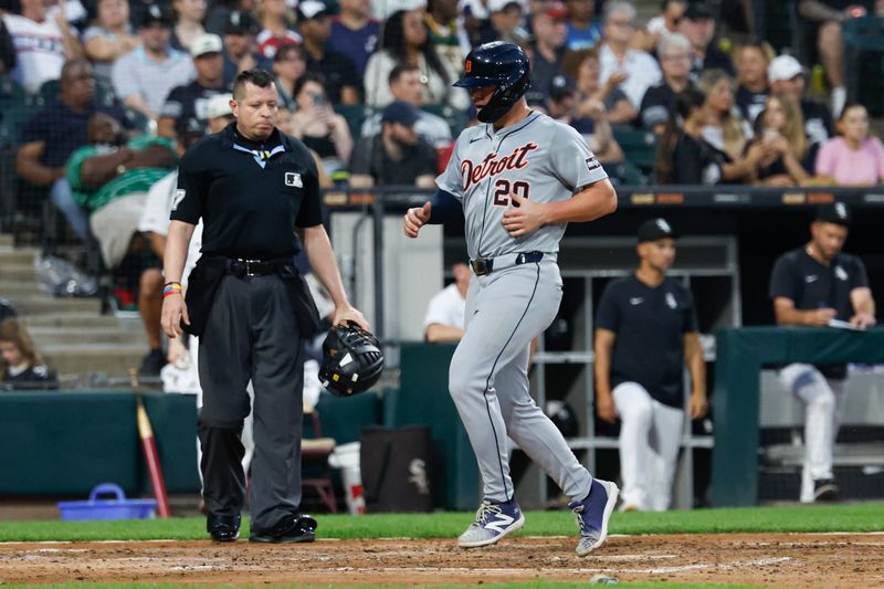 Aug 24, 2024; Chicago, Illinois, USA; Detroit Tigers first baseman Spencer Torkelson (20) scores against the Chicago White Sox during the fourth inning at Guaranteed Rate Field. Mandatory Credit: Kamil Krzaczynski-USA TODAY Sports