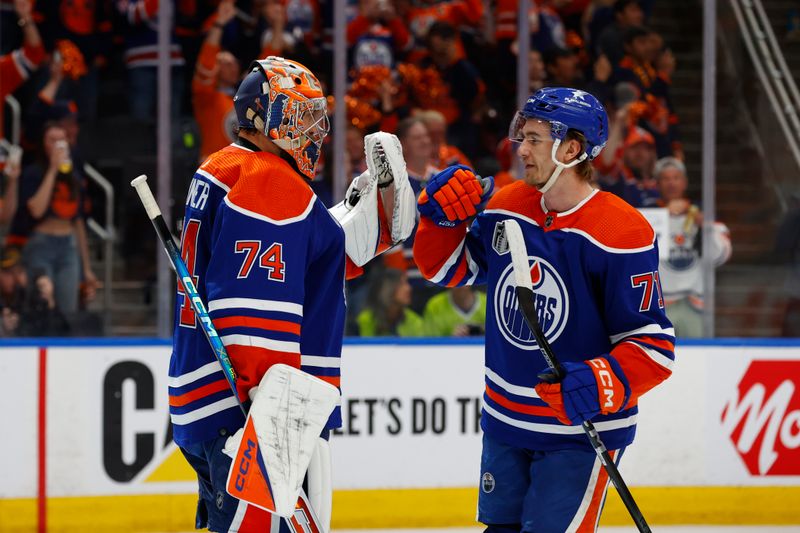 Jun 15, 2024; Edmonton, Alberta, CAN; Edmonton Oilers goaltender Stuart Skinner (74) and center Ryan McLeod (71) celebrate defeating the Florida Panthers in game four of the 2024 Stanley Cup Final at Rogers Place. Mandatory Credit: Perry Nelson-USA TODAY Sports