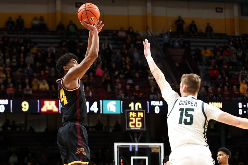 Feb 6, 2024; Minneapolis, Minnesota, USA; Minnesota Golden Gophers guard Cam Christie (24) shoots as Michigan State Spartans center Carson Cooper (15) defends during the first half at Williams Arena. Mandatory Credit: Matt Krohn-USA TODAY Sports