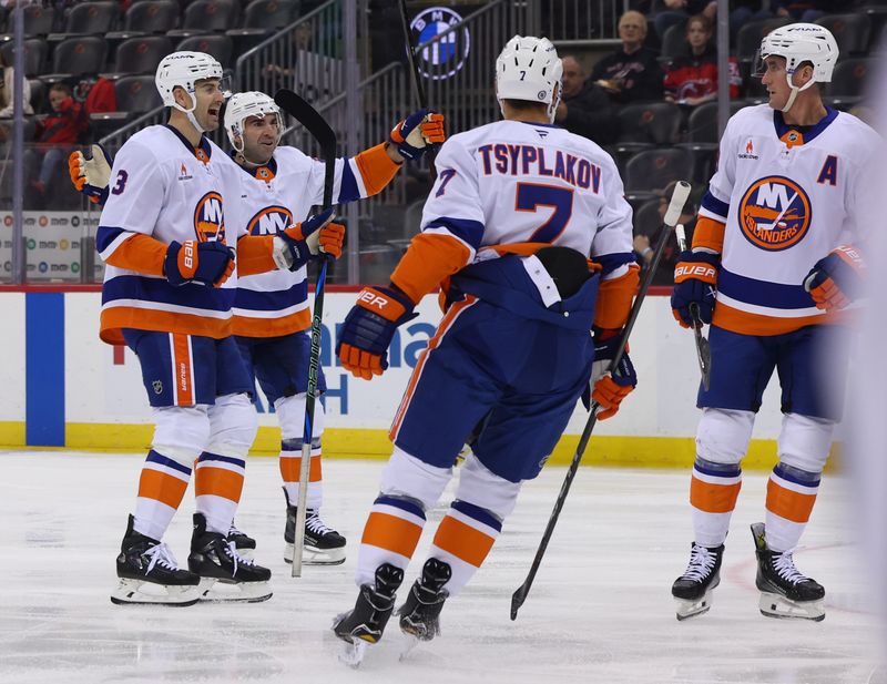 Oct 25, 2024; Newark, New Jersey, USA; New York Islanders center Brock Nelson (29) celebrates his goal against the New Jersey Devils during the first period at Prudential Center. Mandatory Credit: Ed Mulholland-Imagn Images