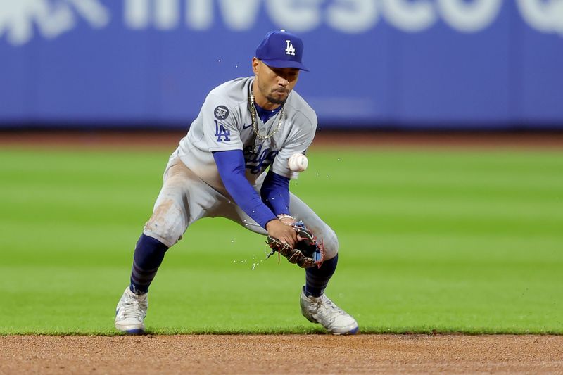 May 23, 2025; New York City, New York, USA; Los Angeles Dodgers shortstop Mookie Betts (50) fields a ground ball hit by New York Mets catcher Francisco Alvarez (not pictured) during the third inning at Citi Field. Mandatory Credit: Brad Penner-Imagn Images