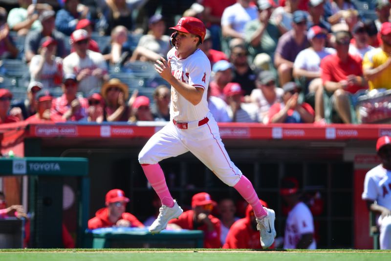 May 12, 2024; Anaheim, California, USA; Los Angeles Angels center fielder Mickey Moniak (16) runs home to score against the Kansas City Royals during the sixth inning at Angel Stadium. Mandatory Credit: Gary A. Vasquez-USA TODAY Sports