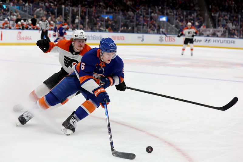 Jan 24, 2025; Elmont, New York, USA; New York Islanders defenseman Ryan Pulock (6) skates with the puck against Philadelphia Flyers right wing Owen Tippett (74) during the first period at UBS Arena. Mandatory Credit: Brad Penner-Imagn Images