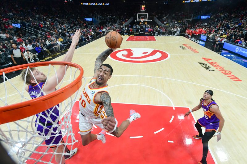 ATLANTA, GA - FEBUARY 9: John Collins #20 of the Atlanta Hawks goes to the basket during the game on Febuary 9, 2023 at State Farm Arena in Atlanta, Georgia.  NOTE TO USER: User expressly acknowledges and agrees that, by downloading and/or using this Photograph, user is consenting to the terms and conditions of the Getty Images License Agreement. Mandatory Copyright Notice: Copyright 2023 NBAE (Photo by Adam Hagy/NBAE via Getty Images)