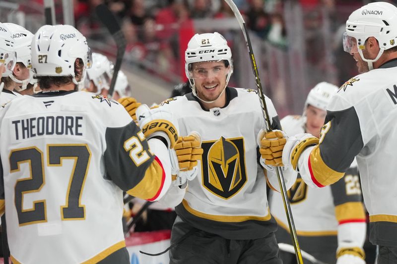 Oct 28, 2025; Raleigh, North Carolina, USA; Vegas Golden Knights center Brett Howden (21) celebrates his goal against the Carolina Hurricanes during the third period at Lenovo Center. Mandatory Credit: James Guillory-Imagn Images