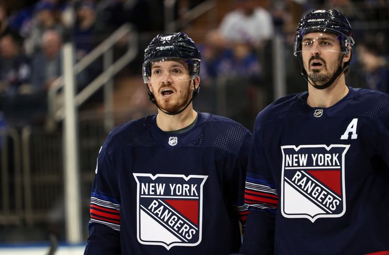 Mar 9, 2024; New York, New York, USA: New York Rangers center Jake Roslovic (96) awaits a face-off next to New York Rangers left wing Chris Kreider (20) during the first period against the St. Louis Blues at Madison Square Garden. Mandatory Credit: Danny Wild-USA TODAY Sports