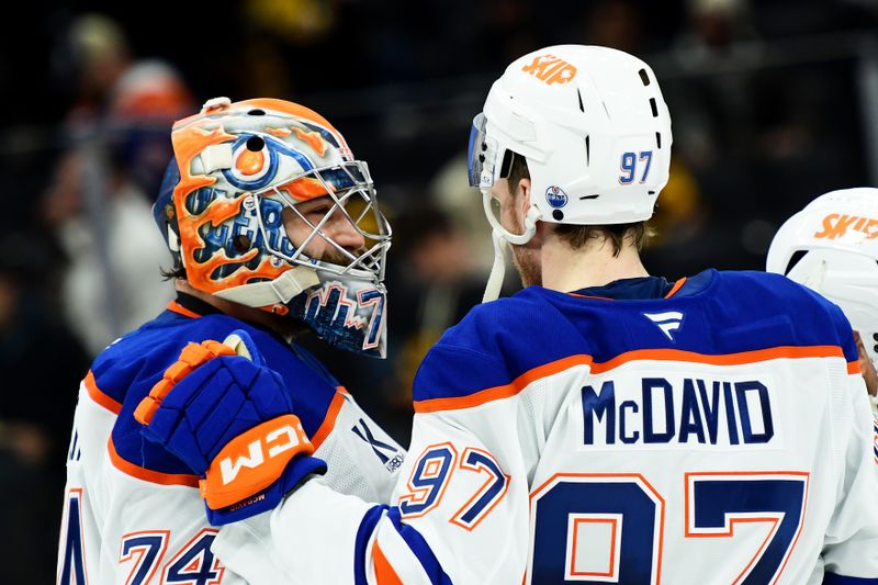 Jan 7, 2025; Boston, Massachusetts, USA;  Edmonton Oilers center Connor McDavid (97) congratulates goaltender Stuart Skinner (74) after defeating the Boston Bruins at TD Garden. Mandatory Credit: Bob DeChiara-Imagn Images