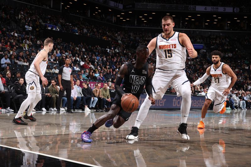 BROOKLYN, NY - OCTOBER 29: Dennis Schroder #17 of the Brooklyn Nets drives to the basket during the game against the Denver Nuggets on October 29, 2024 at Barclays Center in Brooklyn, New York. NOTE TO USER: User expressly acknowledges and agrees that, by downloading and or using this Photograph, user is consenting to the terms and conditions of the Getty Images License Agreement. Mandatory Copyright Notice: Copyright 2024 NBAE (Photo by Nathaniel S. Butler/NBAE via Getty Images)