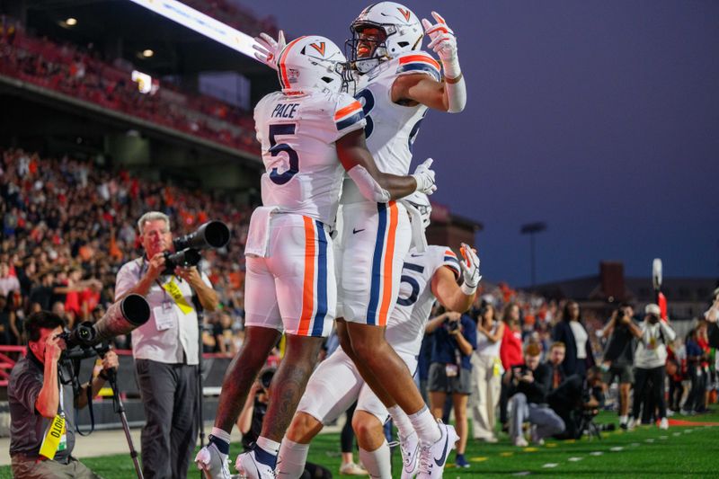 Sep 15, 2023; College Park, Maryland, USA; Virginia Cavaliers running back Kobe Pace (5) celebrates with teammates after scoring a touchdown during the first quarter against the Maryland Terrapins at SECU Stadium. Mandatory Credit: Reggie Hildred-USA TODAY Sports