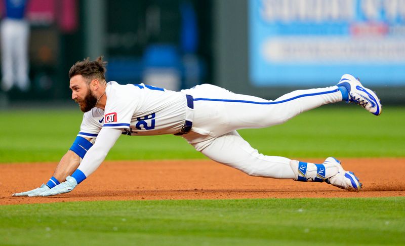 May 28, 2025; Kansas City, Missouri, USA; Kansas City Royals right fielder John Rave (26) slides into second base for a double during the fifth inning against the Cincinnati Reds at Kauffman Stadium. Mandatory Credit: Jay Biggerstaff-Imagn Images