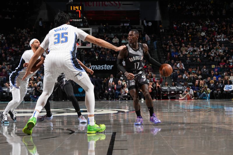 BROOKLYN, NY - DECEMBER 1: Dennis Schroder #17 of the Brooklyn Nets dribbles the ball during the game against the Orlando Magic on December 1, 2024 at Barclays Center in Brooklyn, New York. NOTE TO USER: User expressly acknowledges and agrees that, by downloading and or using this Photograph, user is consenting to the terms and conditions of the Getty Images License Agreement. Mandatory Copyright Notice: Copyright 2024 NBAE (Photo by Jesse D. Garrabrant/NBAE via Getty Images)