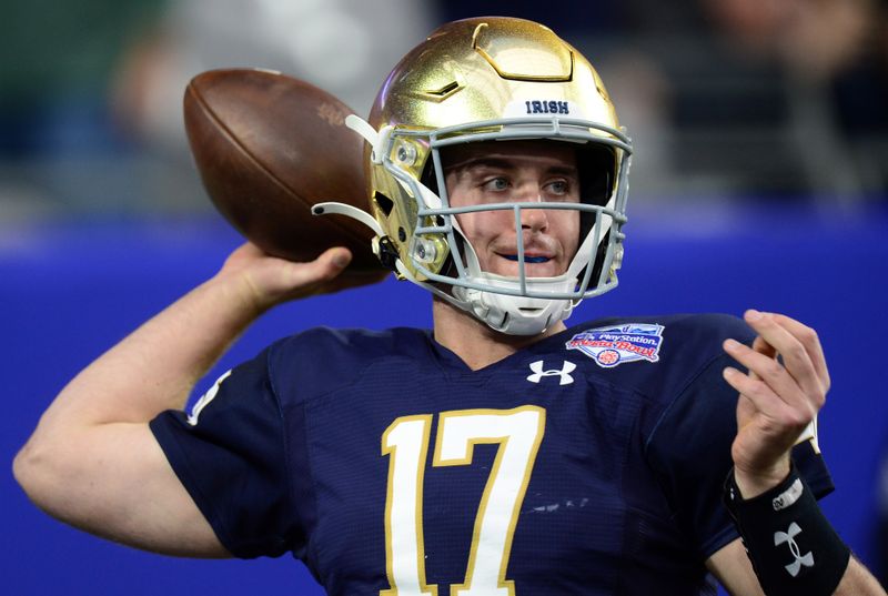 Jan 1, 2022; Glendale, Arizona, USA; Notre Dame Fighting Irish quarterback Jack Coan (17) warms up prior to facing the Oklahoma State Cowboys in the 2022 Fiesta Bowl at State Farm Stadium. Mandatory Credit: Joe Camporeale-USA TODAY Sports