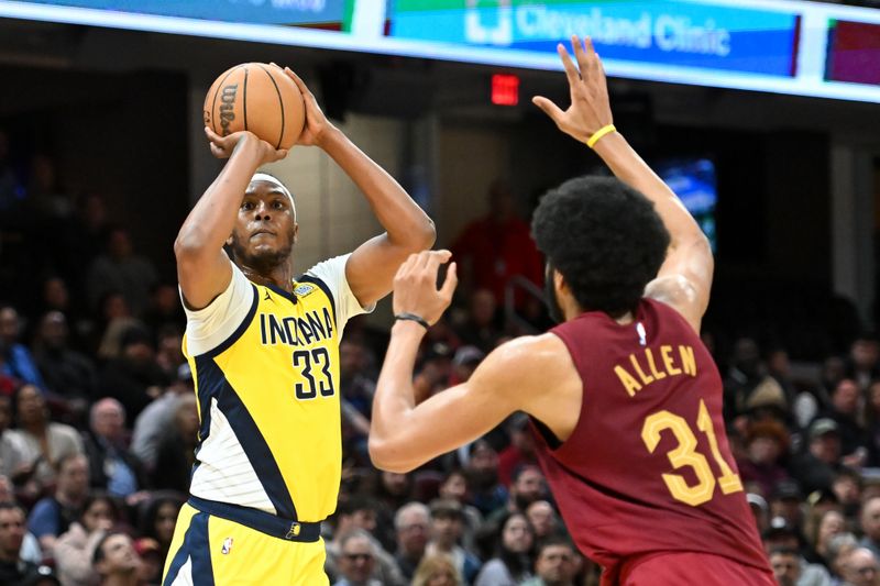 CLEVELAND, OHIO - APRIL 12: Myles Turner #33 of the Indiana Pacers shoots a three-point basket against Jarrett Allen #31 of the Cleveland Cavaliers during the second half at Rocket Mortgage Fieldhouse on April 12, 2024 in Cleveland, Ohio. NOTE TO USER: User expressly acknowledges and agrees that, by downloading and or using this photograph, User is consenting to the terms and conditions of the Getty Images License Agreement. (Photo by Nick Cammett/Getty Images)