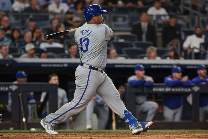 Sep 10, 2024; Bronx, New York, USA; Kansas City Royals catcher Salvador Perez (13) hits an RBI single during the third inning against the New York Yankees at Yankee Stadium. Mandatory Credit: Vincent Carchietta-Imagn Images