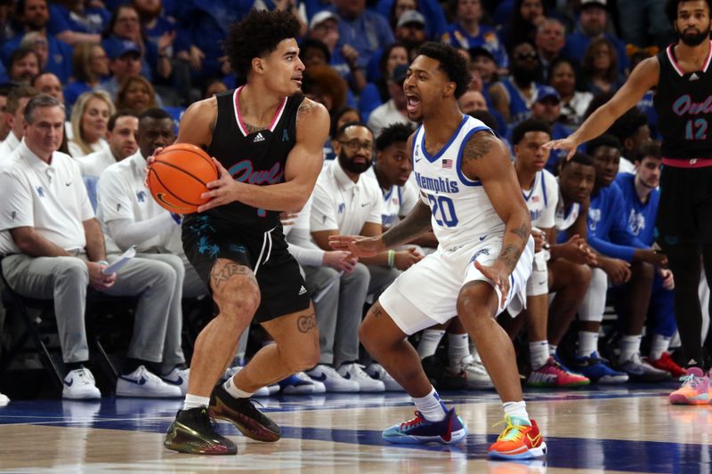 Feb 25, 2024; Memphis, Tennessee, USA; Florida Atlantic Owls guard Bryan Greenlee (4) handles the ball as Memphis Tigers guard Joe Cooper (20) defends during the first half at FedExForum. Mandatory Credit: Petre Thomas-USA TODAY Sports