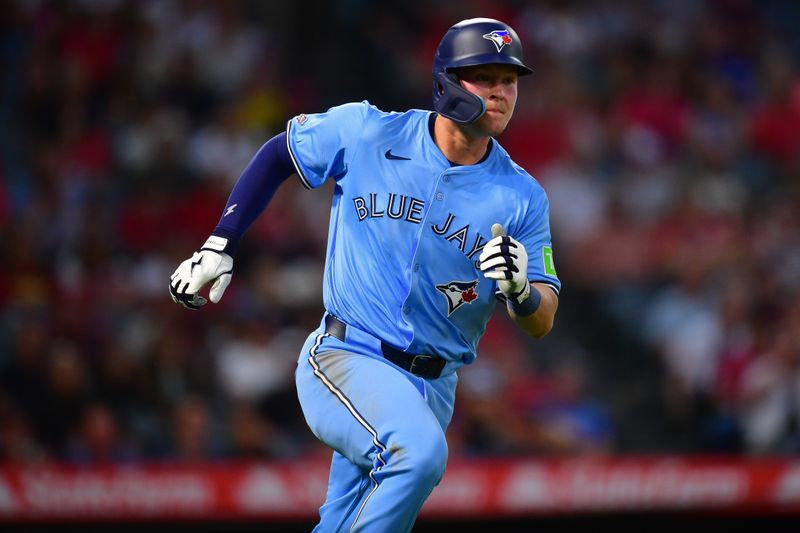 Aug 12, 2024; Anaheim, California, USA; Toronto Blue Jays second baseman Will Wagner (7) runs after hitting a single against the Los Angeles Angels during the fifth inning at Angel Stadium. Mandatory Credit: Gary A. Vasquez-USA TODAY Sports