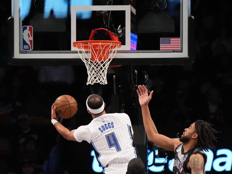 BROOKLYN, NY - DECEMBER 1: Jalen Suggs #4 of the Orlando Magic drives to the basket during the game against the Brooklyn Nets on December 1, 2024 at Barclays Center in Brooklyn, New York. NOTE TO USER: User expressly acknowledges and agrees that, by downloading and or using this Photograph, user is consenting to the terms and conditions of the Getty Images License Agreement. Mandatory Copyright Notice: Copyright 2024 NBAE (Photo by Jesse D. Garrabrant/NBAE via Getty Images)