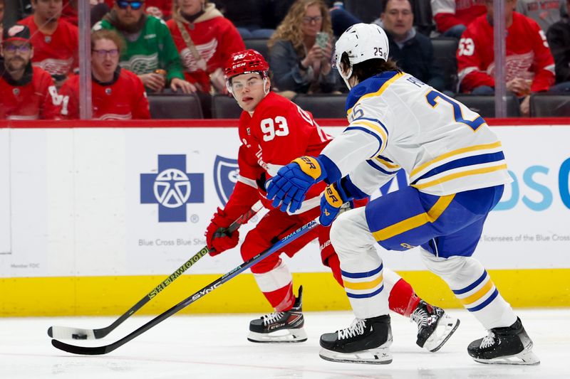 Mar 16, 2024; Detroit, Michigan, USA;  Detroit Red Wings right wing Alex DeBrincat (93) skates with the puck defended by Buffalo Sabres defenseman Owen Power (25) in the second period at Little Caesars Arena. Mandatory Credit: Rick Osentoski-USA TODAY Sports