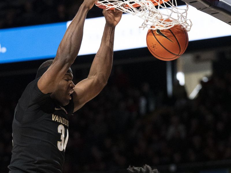 Jan 14, 2023; Nashville, Tennessee, USA;   
Vanderbilt Commodores forward Lee Dort (34) dunks against the Arkansas Razorbacks during the first half at Memorial Gymnasium. Mandatory Credit: George Walker IV - USA TODAY Sports