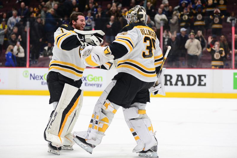 Feb 25, 2023; Vancouver, British Columbia, CAN; Boston Bruins goaltender Linus Ullmark (35) celebrates the win with goaltender Jeremy Swayman (1) after the third period at Rogers Arena. Mandatory Credit: Anne-Marie Sorvin-USA TODAY Sports