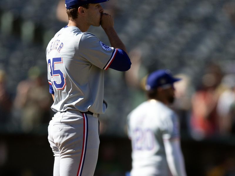 May 8, 2024; Oakland, California, USA; Texas Rangers starting pitcher Jack Leiter (35) reacts to yielding a two-run home run to Oakland Athletics first baseman Tyler Soderstrom during the fourth inning at Oakland-Alameda County Coliseum. Mandatory Credit: D. Ross Cameron-USA TODAY Sports