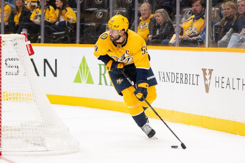 Nov 23, 2024; Nashville, Tennessee, USA;  Nashville Predators defenseman Roman Josi (59) skates behind the net against the Winnipeg Jets during the second period at Bridgestone Arena. Mandatory Credit: Steve Roberts-Imagn Images