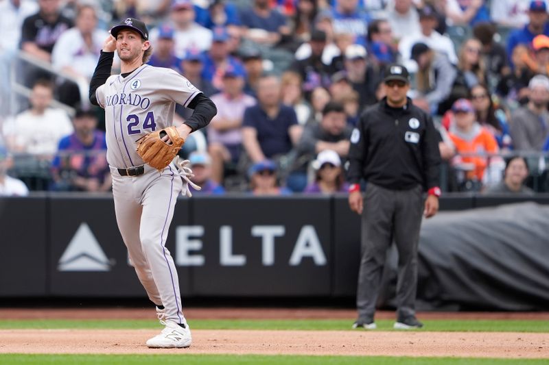 Jun 1, 2025; New York City, New York, USA; Colorado Rockies third baseman Ryan McMahon (24) throws out New York Mets center fielder Tyrone Taylor (15) (not pictured) after fielding a ground ball during the seventh inning at Citi Field. Mandatory Credit: Gregory Fisher-Imagn Images