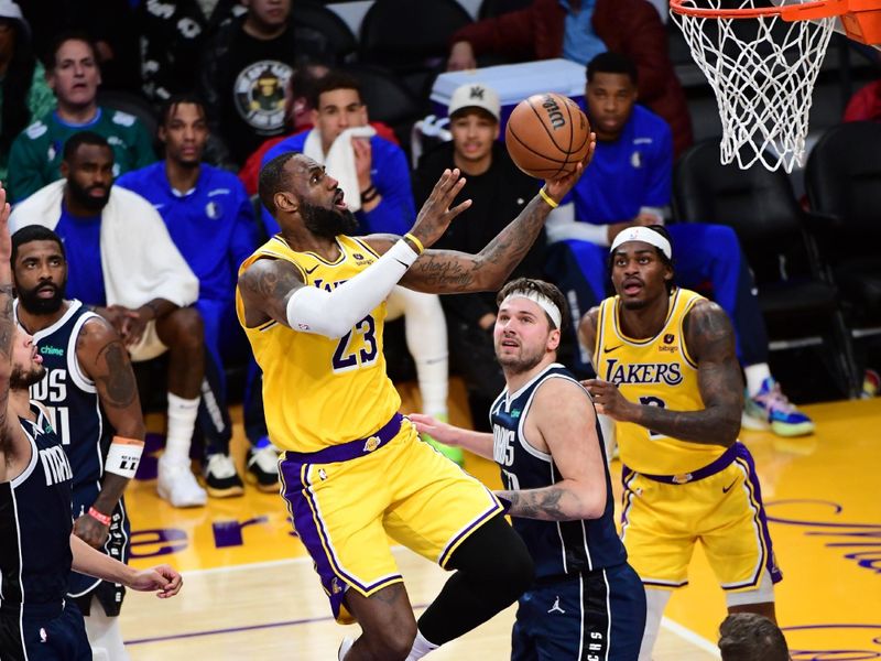 LOS ANGELES, CA - JANUARY 17: LeBron James #23 of the Los Angeles Lakers drives to the basket during the game against the Dallas Mavericks on January 17, 2024 at Crypto.Com Arena in Los Angeles, California. NOTE TO USER: User expressly acknowledges and agrees that, by downloading and/or using this Photograph, user is consenting to the terms and conditions of the Getty Images License Agreement. Mandatory Copyright Notice: Copyright 2024 NBAE (Photo by Adam Pantozzi/NBAE via Getty Images)