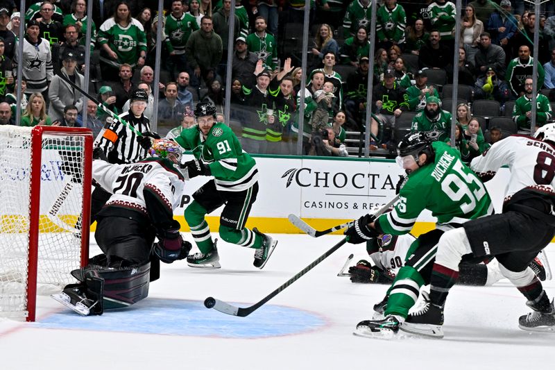 Nov 14, 2023; Dallas, Texas, USA; Dallas Stars center Matt Duchene (95) scores the game winning goal on a pass from center Tyler Seguin (91) against Arizona Coyotes goaltender Karel Vejmelka (70) during the overtime period at the American Airlines Center. Mandatory Credit: Jerome Miron-USA TODAY Sports