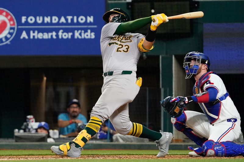 Apr 9, 2024; Arlington, Texas, USA; Oakland Athletics catcher Shea Langeliers (23) follows through on his third home run of the game during the ninth inning against the Texas Rangers at Globe Life Field. Mandatory Credit: Raymond Carlin III-USA TODAY Sports