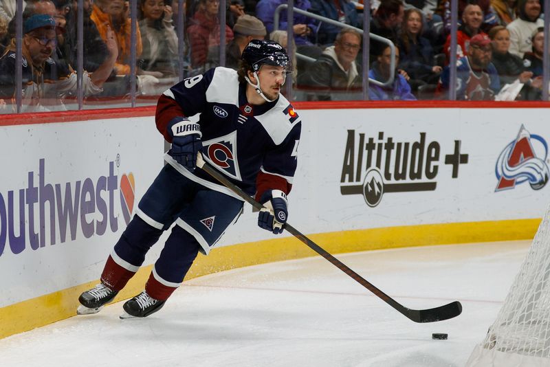 Dec 13, 2025; Denver, Colorado, USA; Colorado Avalanche defenseman Samuel Girard (49) controls the puck in the first period against the Nashville Predators at Ball Arena. Mandatory Credit: Isaiah J. Downing-Imagn Images