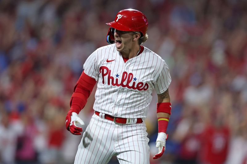 Oct 4, 2023; Philadelphia, Pennsylvania, USA; Philadelphia Phillies second baseman Bryson Stott (5) reacts after hitting  a grand slam against the Miami Marlins during the sixth inning for game two of the Wildcard series for the 2023 MLB playoffs at Citizens Bank Park. Mandatory Credit: Bill Streicher-USA TODAY Sports