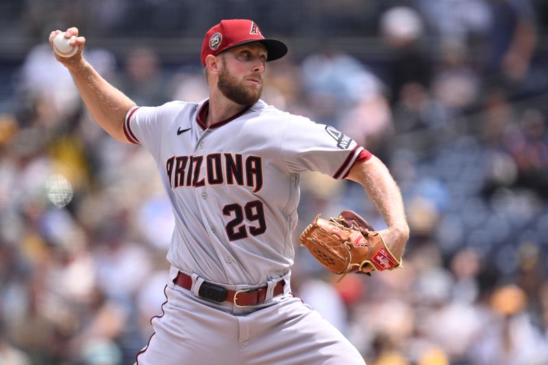 Aug 19, 2023; San Diego, California, USA; Arizona Diamondbacks starting pitcher Merrill Kelly (29) throws a pitch against the San Diego Padres during the first inning at Petco Park. Mandatory Credit: Orlando Ramirez-USA TODAY Sports