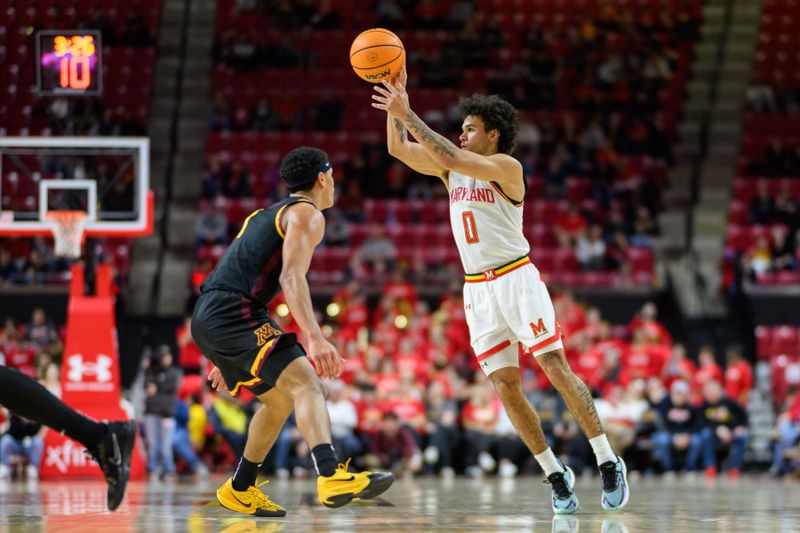 Jan 13, 2025; College Park, Maryland, USA; Maryland Terrapins guard Ja'Kobi Gillespie (0) passes the ball as Minnesota Golden Gophers guard Isaac Asuma (1) defends during the second half at Xfinity Center. Mandatory Credit: Reggie Hildred-Imagn Images