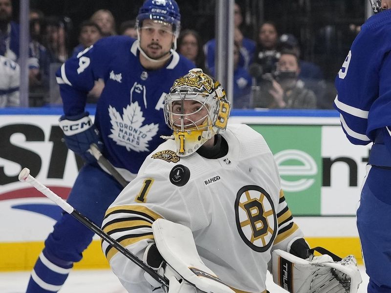 Apr 24, 2024; Toronto, Ontario, CAN; Boston Bruins goaltender Jeremy Swayman (1) looks for the puck after making a save against the Toronto Maple Leafs during the third period of game three of the first round of the 2024 Stanley Cup Playoffs at Scotiabank Arena. Mandatory Credit: John E. Sokolowski-USA TODAY Sports